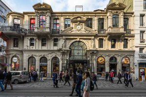 People walk in front of Cite de Pera, or Çiçek Pasajı (Flower Passage), in Beyoğlu, Istanbul, Turkey, October 2018. (Shutterstock Photo)