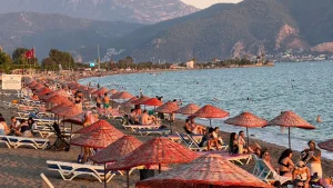 Evening bustle at Çalış Beach as locals seek relief from the heat